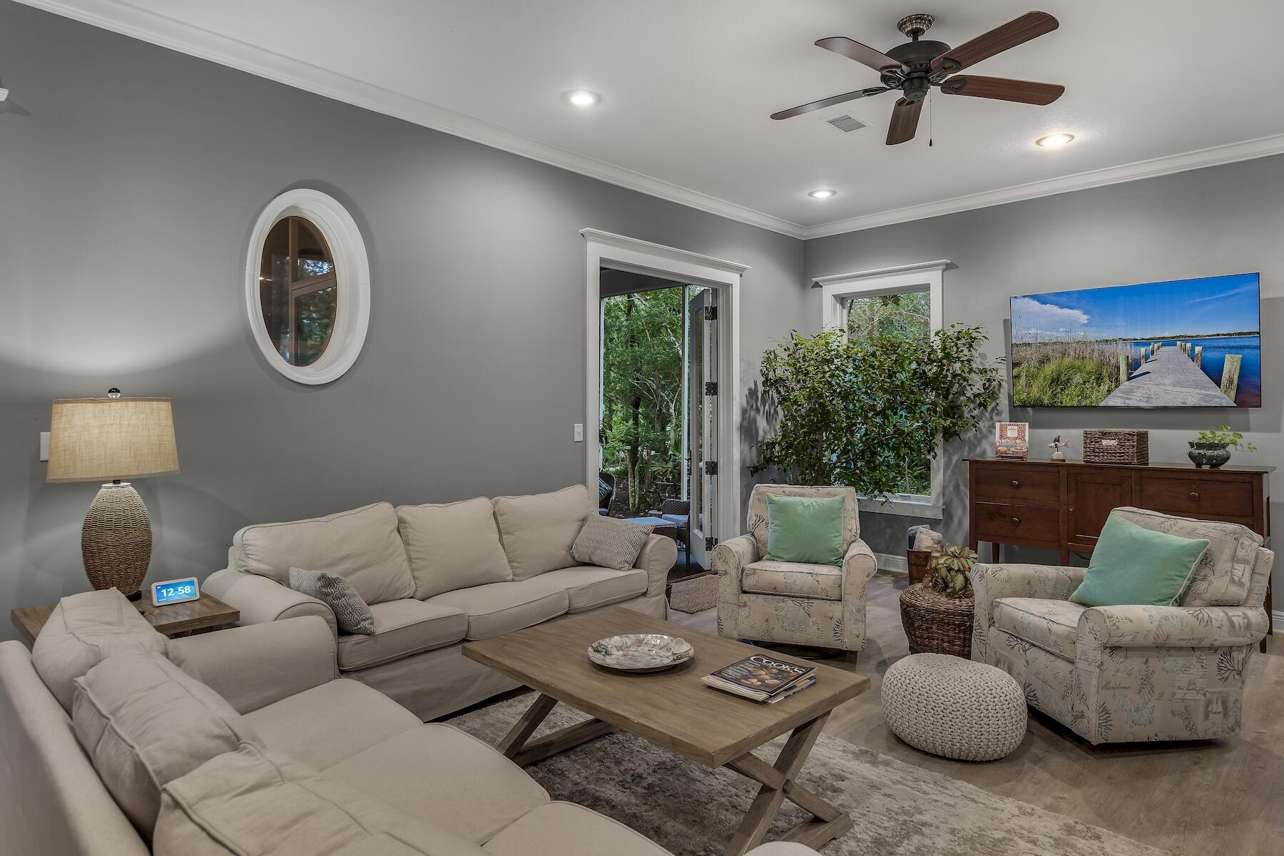 304 Wilderness Way Santa Rosa Beach, FL 32459 - Photo 22 of 48 a living room with furniture and a large window