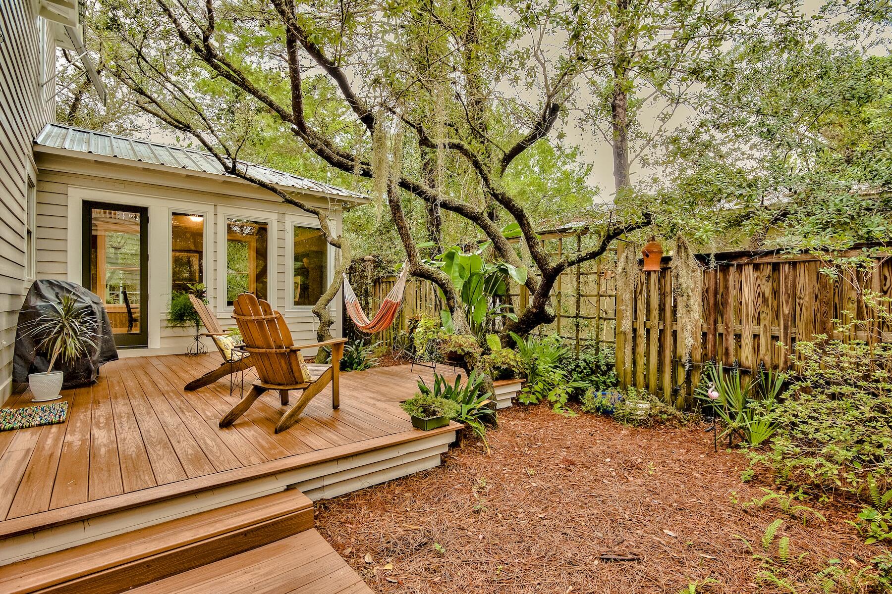 304 Wilderness Way Santa Rosa Beach, FL 32459 - Photo 27 of 48 a view of a house with backyard porch and sitting area