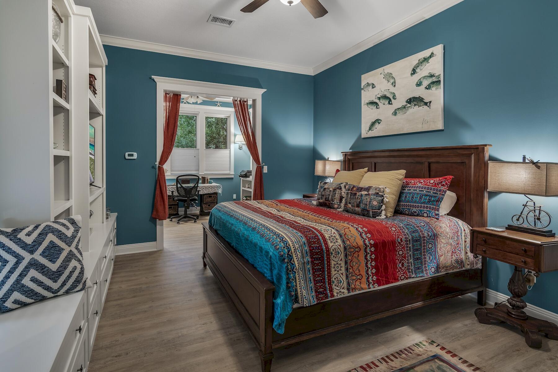 304 Wilderness Way Santa Rosa Beach, FL 32459 - Photo 31 of 48 a bedroom with a bed and a chandelier