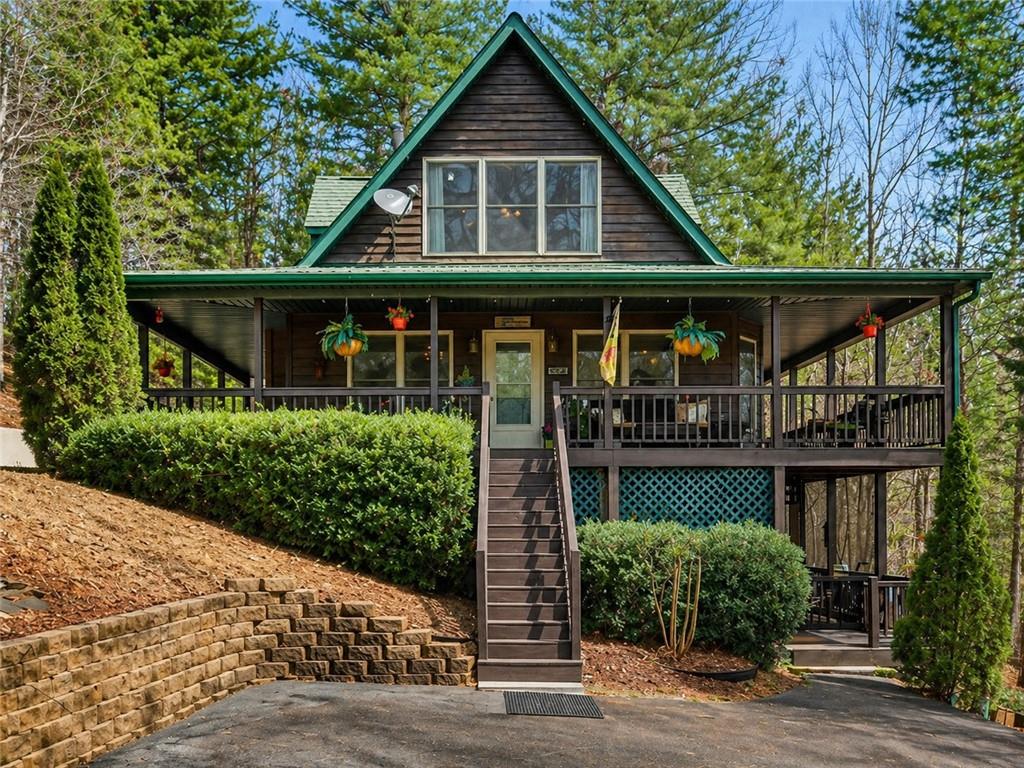 88 Crest Road Blairsville, GA 30512 - Photo 1 of 75 a front view of house with a garden