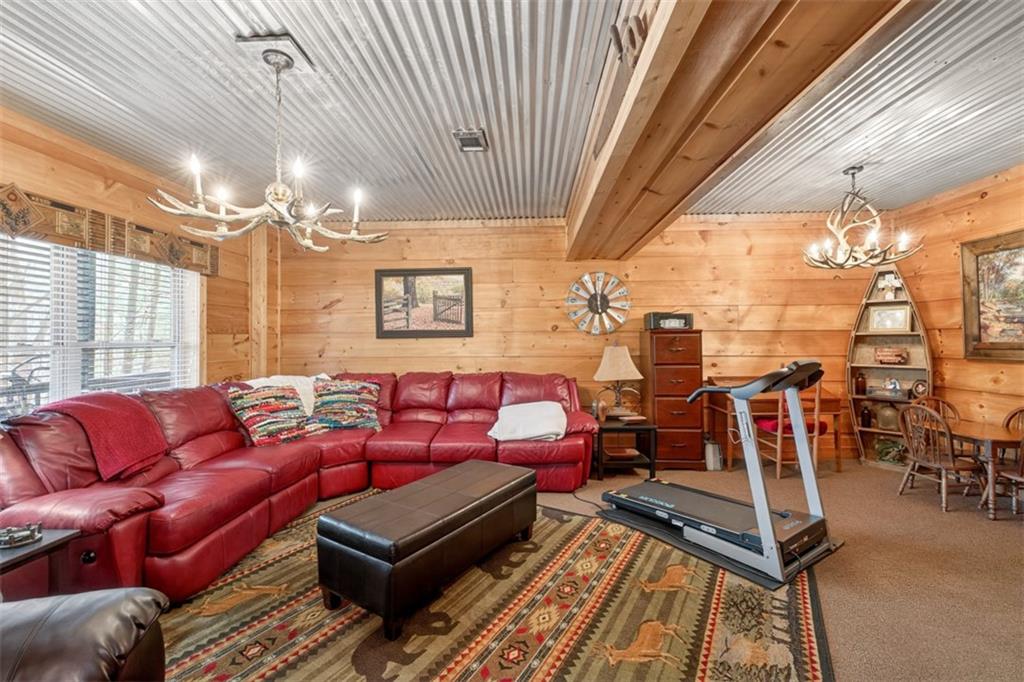 88 Crest Road Blairsville, GA 30512 - Photo 31 of 75 a living room with furniture a chandelier