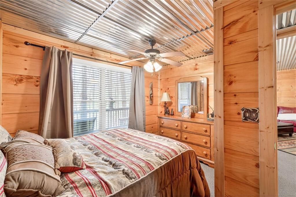 88 Crest Road Blairsville, GA 30512 - Photo 34 of 75 a bedroom with a bed next to a window