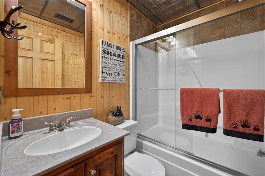 88 Crest Road Blairsville, GA 30512 - Photo 36 of 75 a bathroom with a sink and a mirror