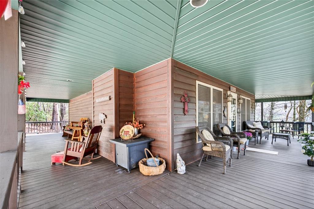 88 Crest Road Blairsville, GA 30512 - Photo 51 of 75 a view of a patio with table and chairs and wooden floor