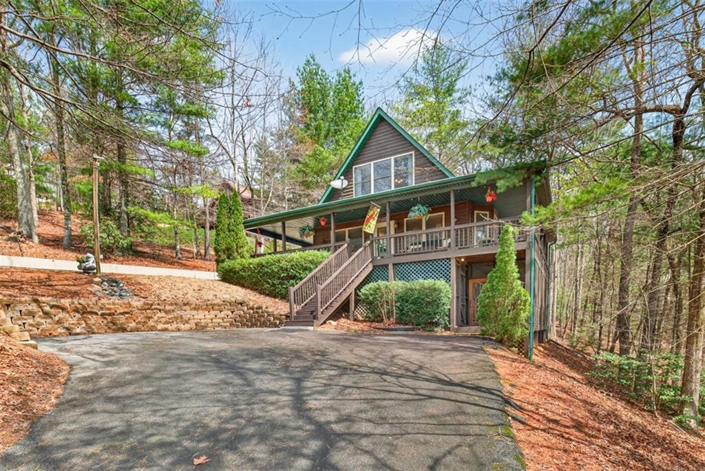 88 Crest Road Blairsville, GA 30512 - Photo 61 of 75 a front view of a house with a yard and potted plants