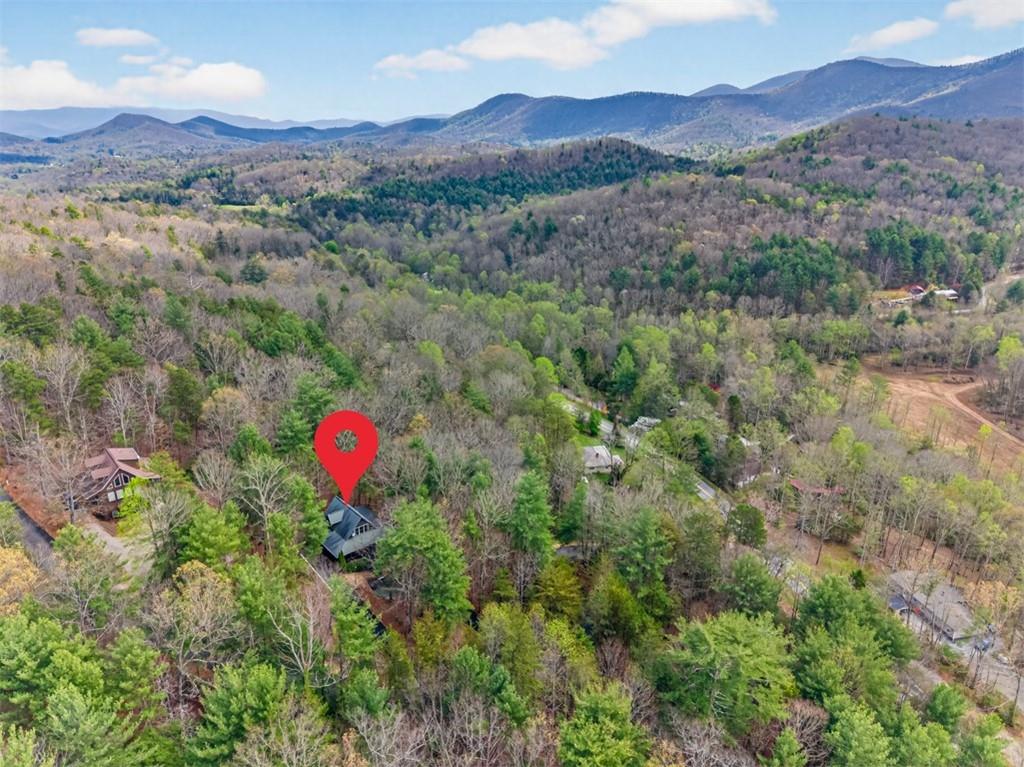 88 Crest Road Blairsville, GA 30512 - Photo 65 of 75 a view of a lush green hillside and a houses