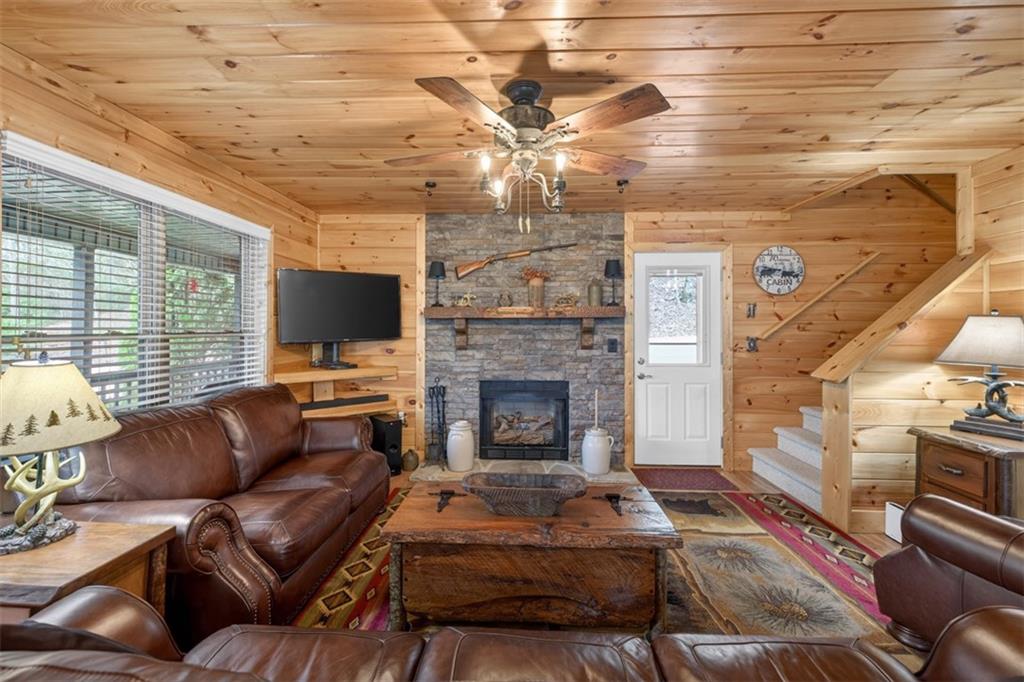 88 Crest Road Blairsville, GA 30512 - Photo 8 of 75 a living room with furniture and a fireplace