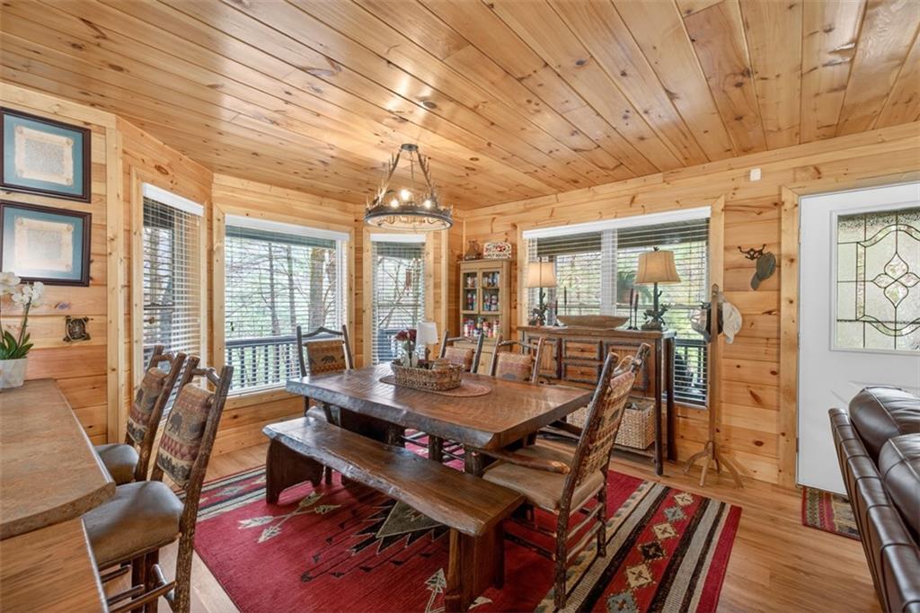 88 Crest Road Blairsville, GA 30512 - Photo 10 of 75 a view of a dining room with furniture window and wooden floor