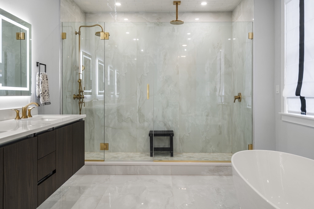 32 Pearl Street, Unit 4 Boston, MA 02125 - Photo 26 of 35 a bathroom with a bathtub and a sink
