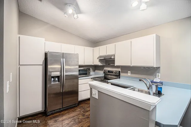 a bedroom with a bed window and a table