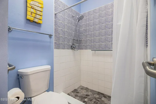 a bedroom with bed and a window