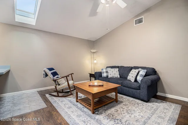 a kitchen with stainless steel appliances wooden cabinets and a stove