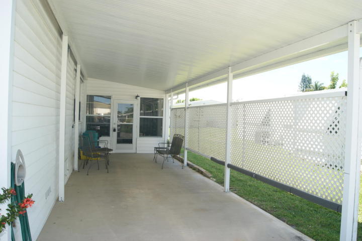 6948 Southeast Delegate Street Hobe Sound, FL 33455 - Photo 15 of 17 a view of a balcony with chairs