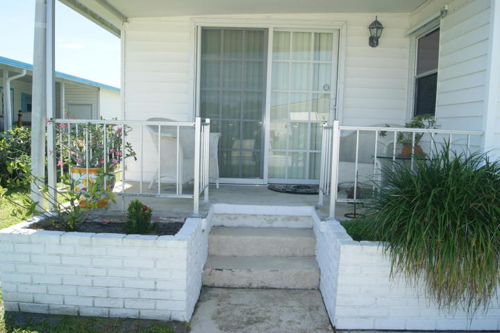 6948 Southeast Delegate Street Hobe Sound, FL 33455 - Photo 16 of 17 a view of house with outdoor space