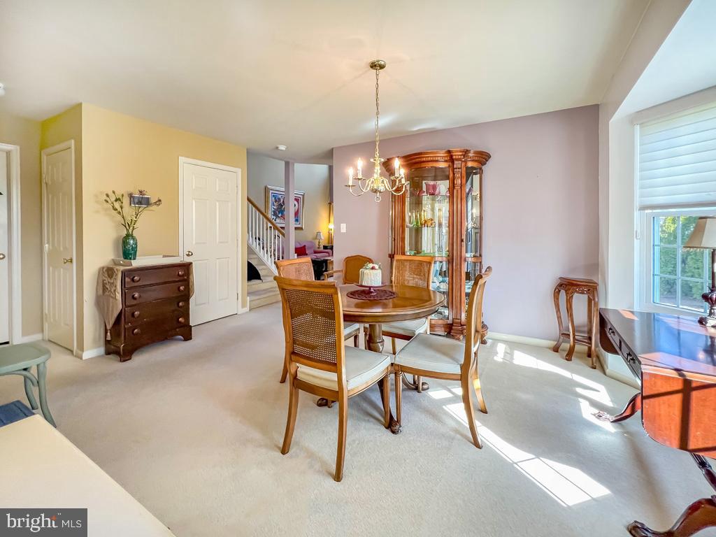 201 Raintree Crossing Hatfield, PA 19440 - Photo 11 of 46 a dining room with furniture and chandelier kitchen view