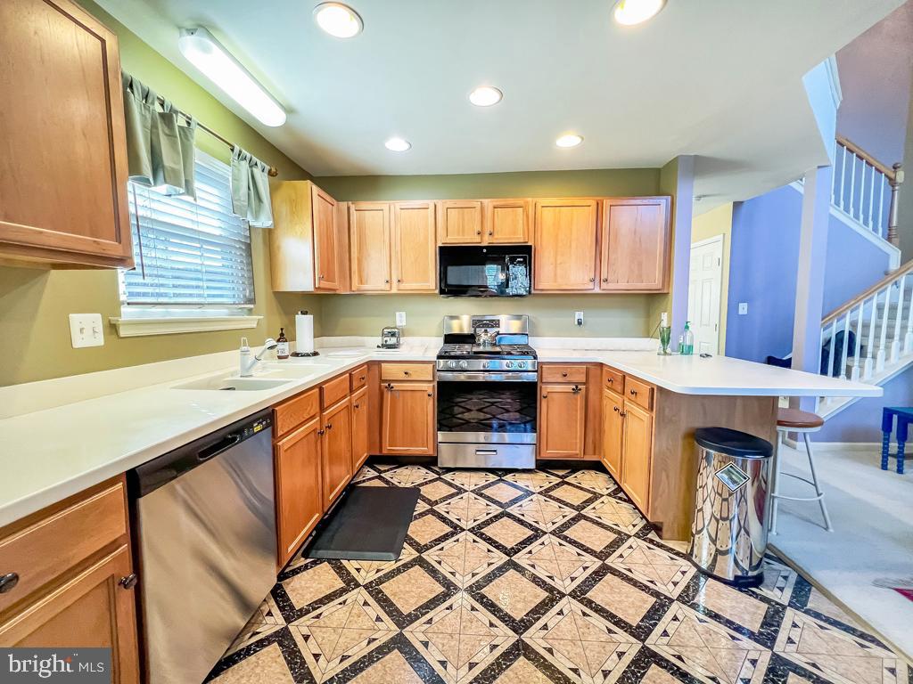 201 Raintree Crossing Hatfield, PA 19440 - Photo 22 of 46 a kitchen with a sink a counter top space and appliances