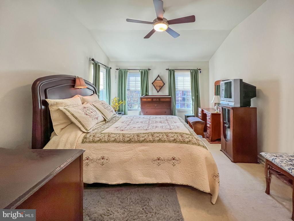 201 Raintree Crossing Hatfield, PA 19440 - Photo 26 of 46 a bedroom with a bed and wooden floor