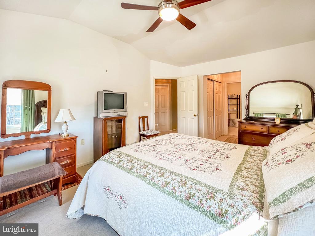 201 Raintree Crossing Hatfield, PA 19440 - Photo 34 of 46 a bedroom with a bed a dresser and flat screen tv