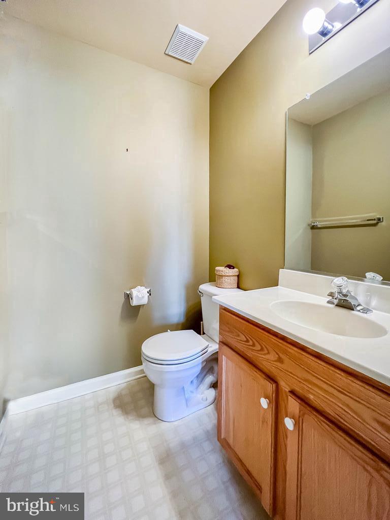 201 Raintree Crossing Hatfield, PA 19440 - Photo 37 of 46 a bathroom with a sink a toilet and a mirror
