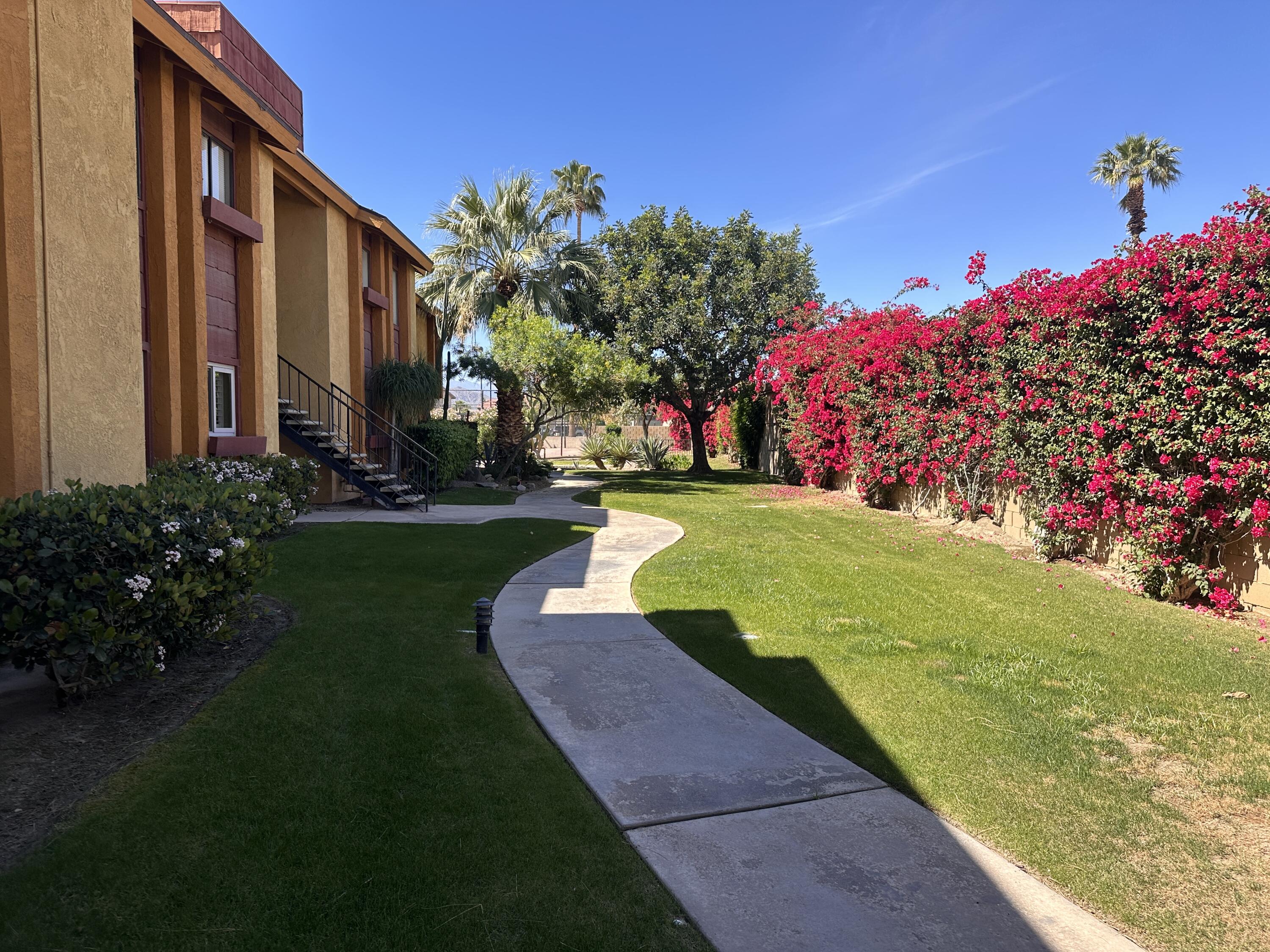48255 Monroe Street, Unit 5 Indio, CA 92201 - Photo 11 of 57 a view of a building with garden