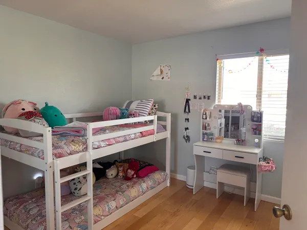 a bedroom with a bed and a mirror