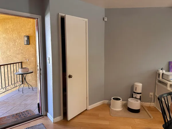 a white bath tub sitting in a small bathroom