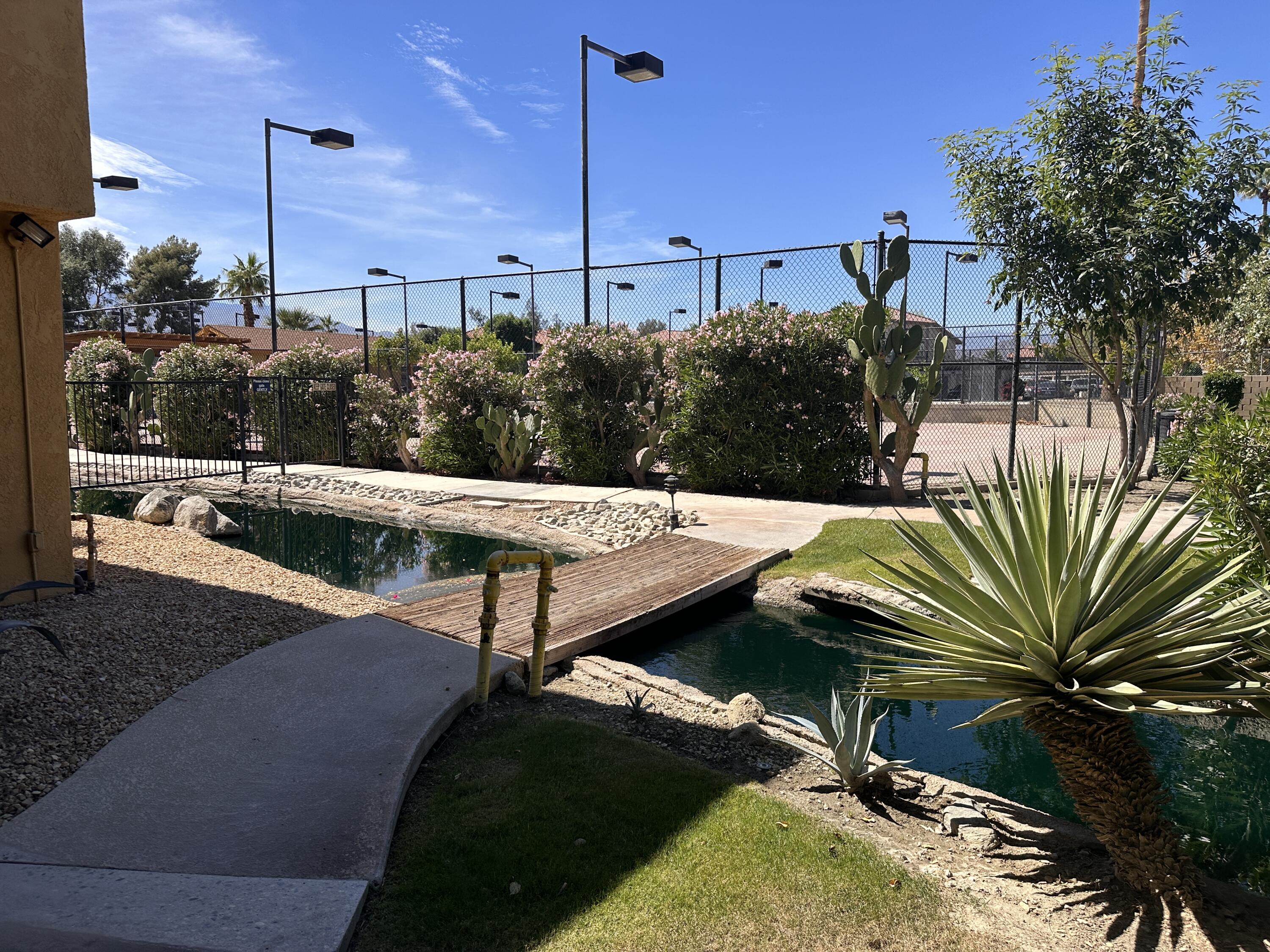 48255 Monroe Street, Unit 5 Indio, CA 92201 - Photo 9 of 57 a view of a backyard with plants