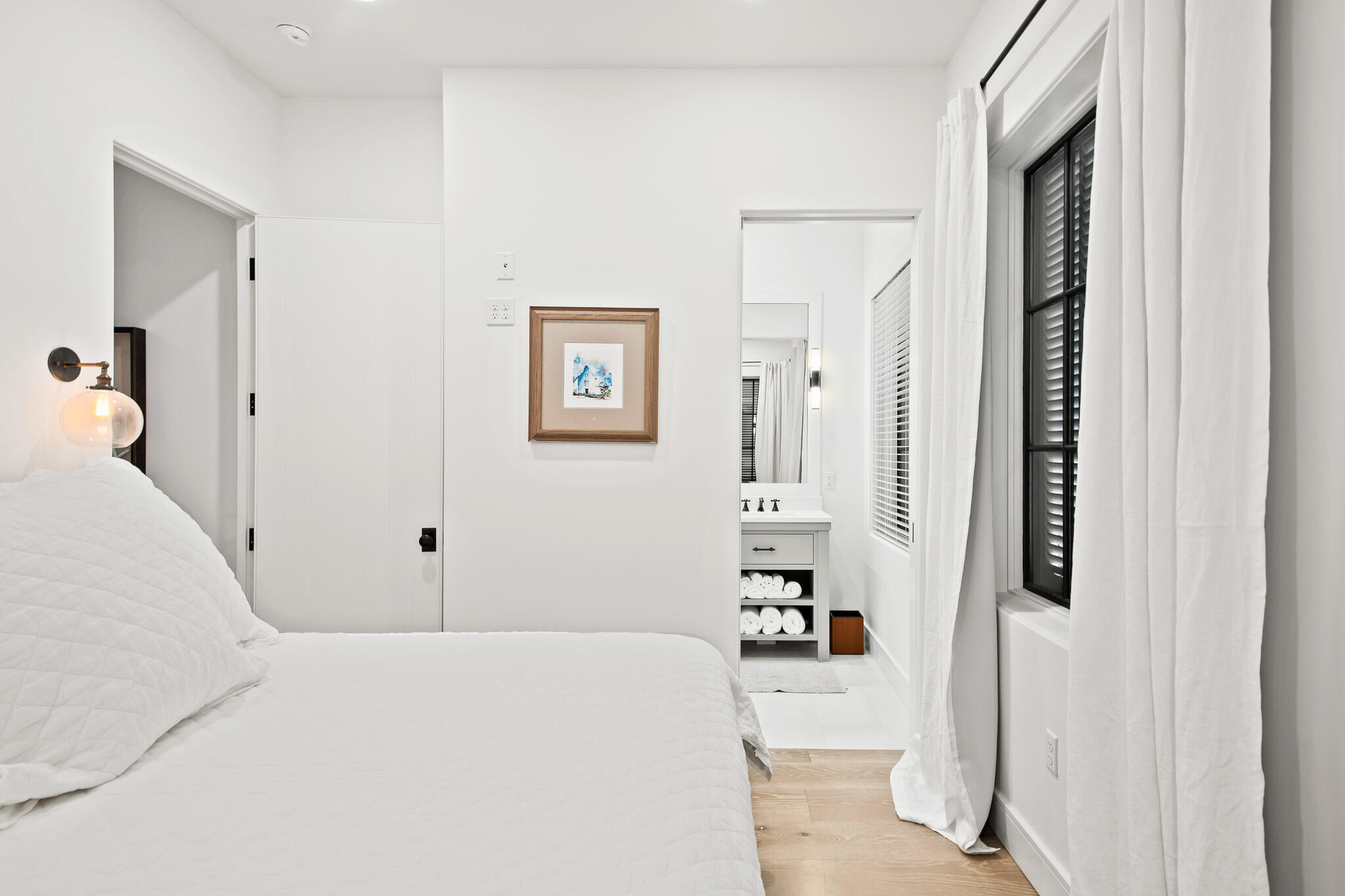 70 Windward Lane Rosemary Beach, FL 32461 - Photo 28 of 101 a bedroom with a bed and a refrigerator