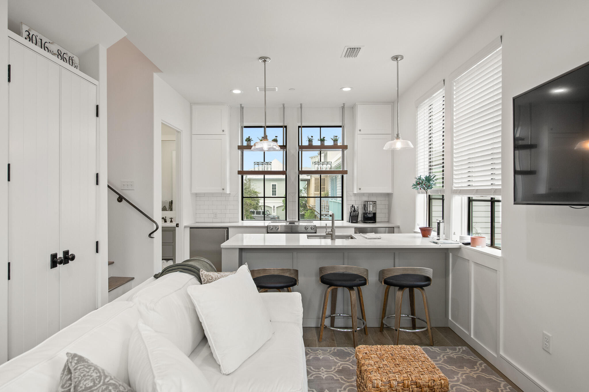 70 Windward Lane Rosemary Beach, FL 32461 - Photo 76 of 101 a kitchen with a sink a counter top space stainless steel appliances and a window