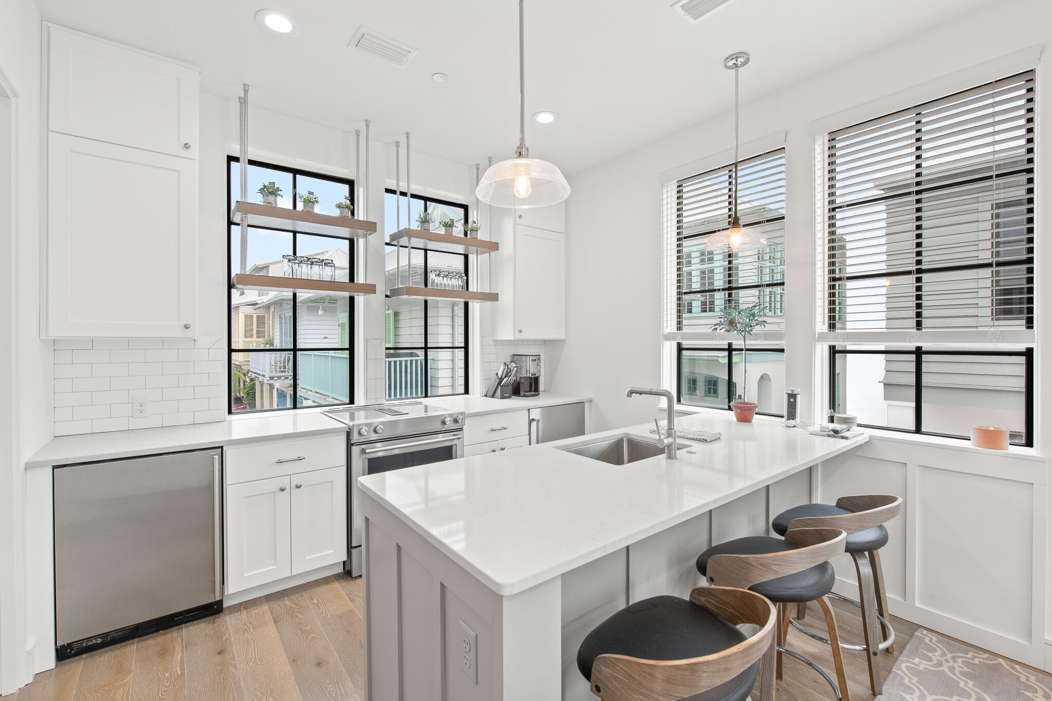 70 Windward Lane Rosemary Beach, FL 32461 - Photo 78 of 101 a kitchen with granite countertop stainless steel appliances a sink and cabinets