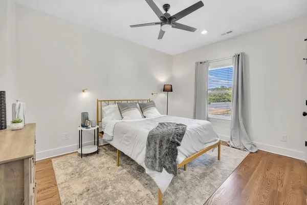 a bedroom with a bed and a couch