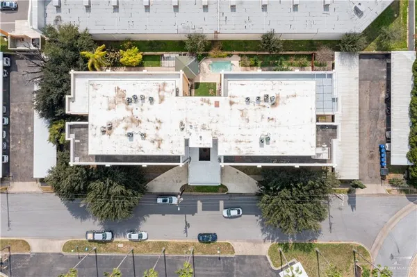 an aerial view of a house with outdoor space