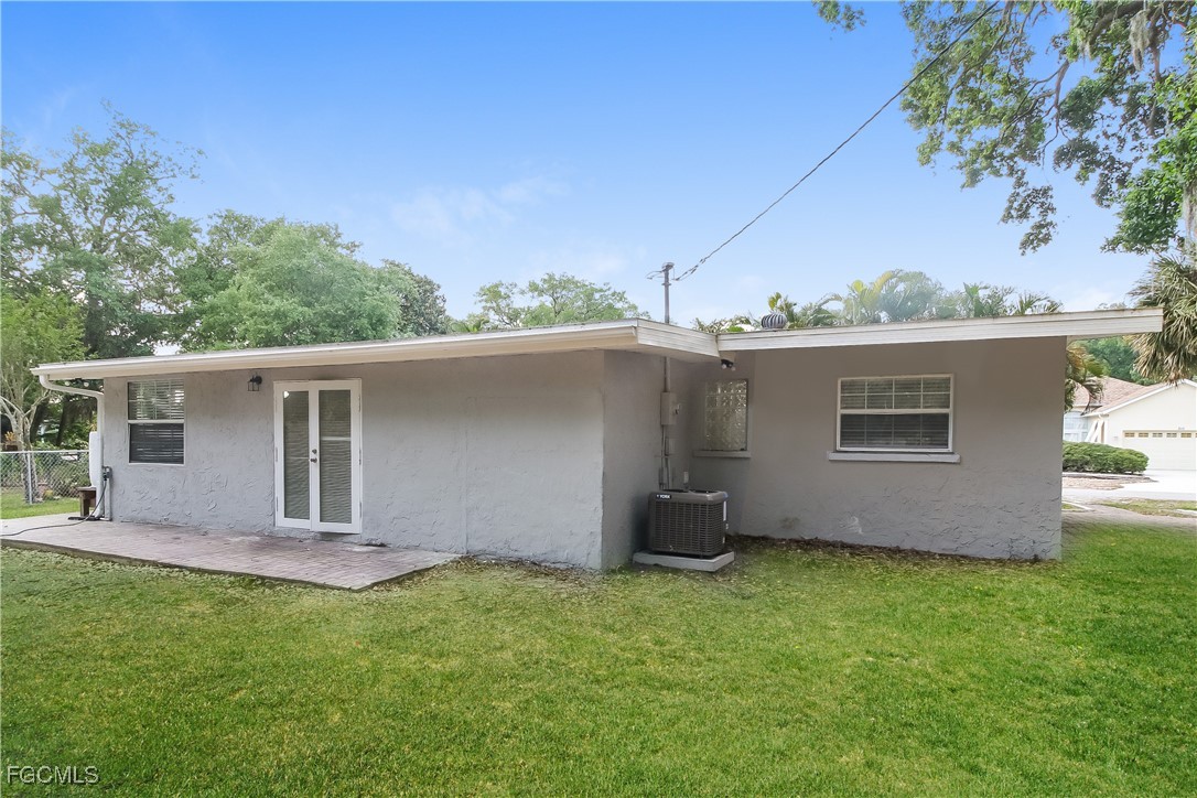 315 Ginger Road Venice, FL 34293 - Photo 15 of 16 a backyard of a house with table and chairs