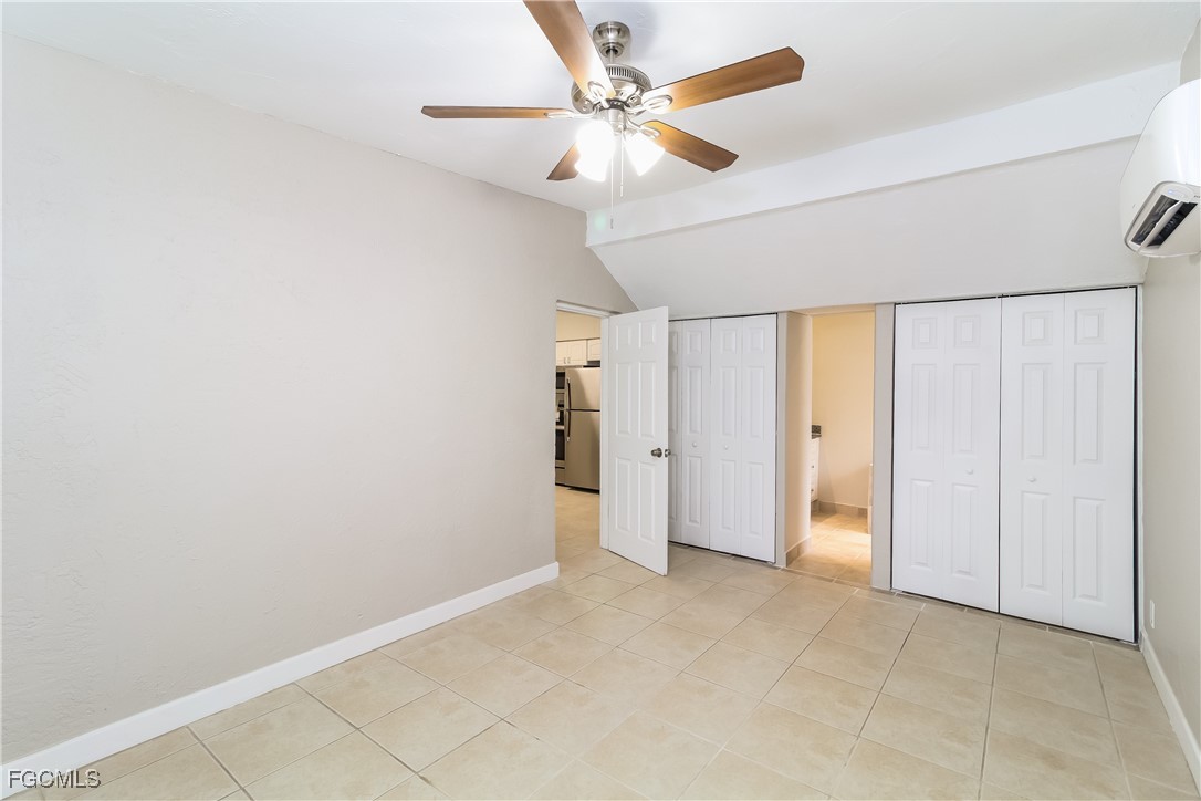 315 Ginger Road Venice, FL 34293 - Photo 8 of 16 an empty room with fan and a ceiling fan