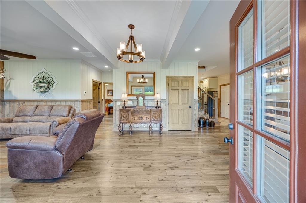 5911 Bent Tree Way Clermont, GA 30527 - Photo 26 of 56 a living room with furniture and a large window