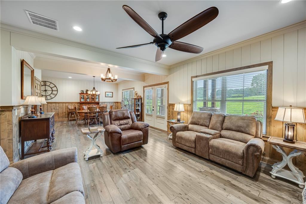 5911 Bent Tree Way Clermont, GA 30527 - Photo 28 of 56 a living room with furniture and a large window