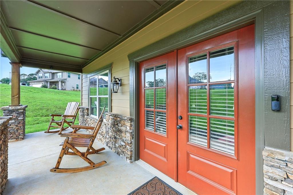 5911 Bent Tree Way Clermont, GA 30527 - Photo 4 of 56 a view of a chair and table in the garden