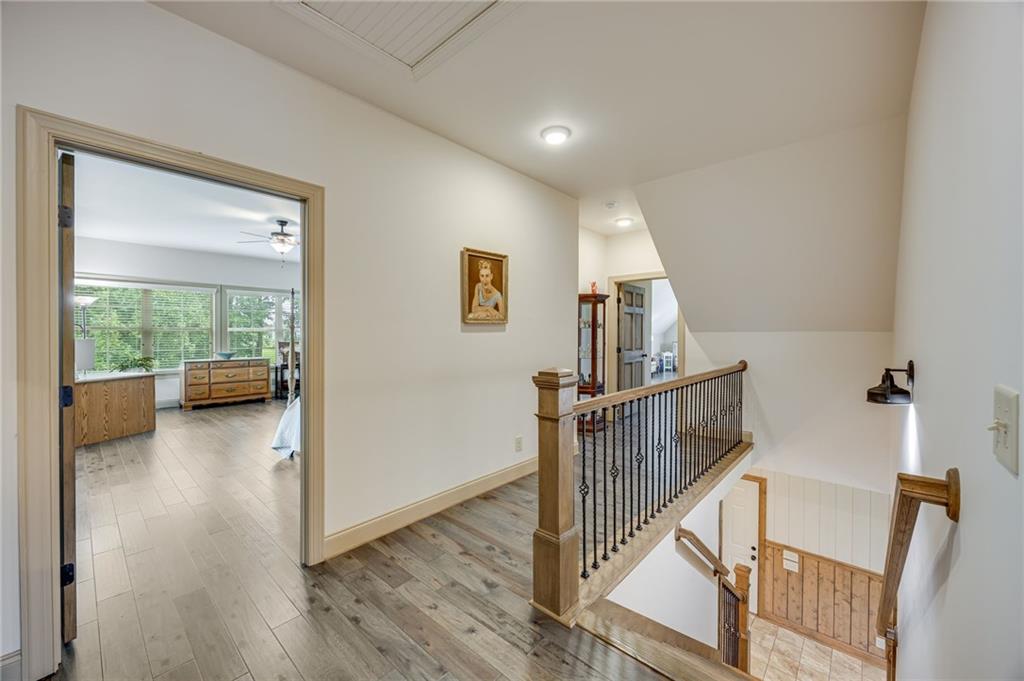 5911 Bent Tree Way Clermont, GA 30527 - Photo 45 of 56 a view of a livingroom with furniture and stairs