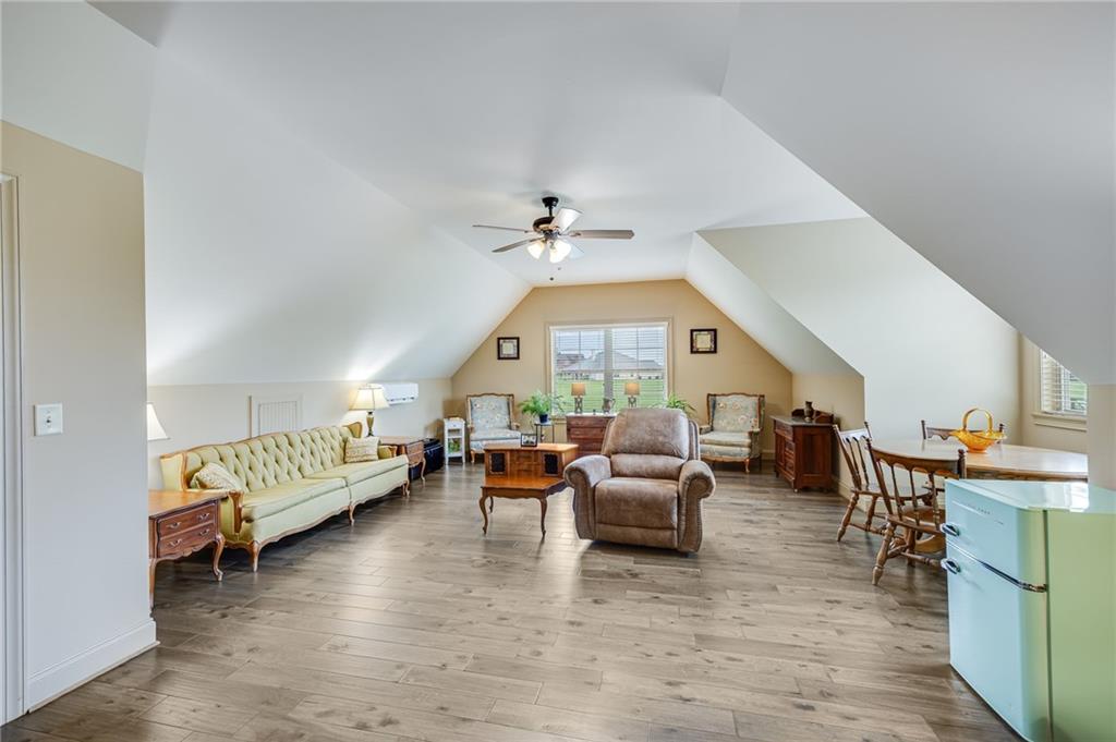 5911 Bent Tree Way Clermont, GA 30527 - Photo 48 of 56 a living room with furniture and a large window