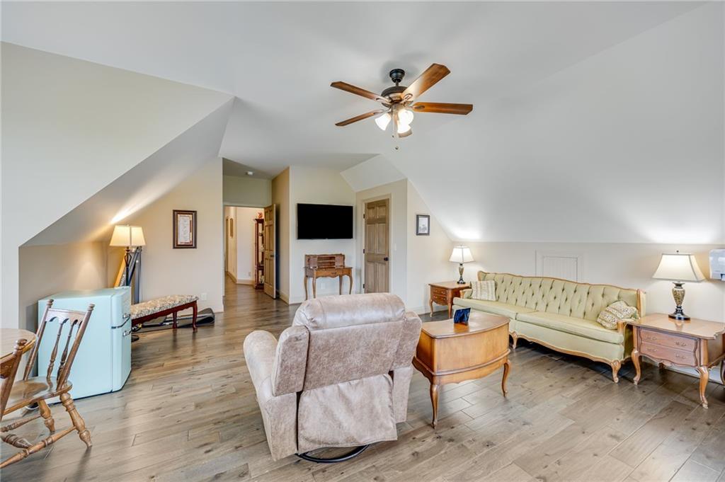 5911 Bent Tree Way Clermont, GA 30527 - Photo 49 of 56 a living room with furniture and a wooden floor
