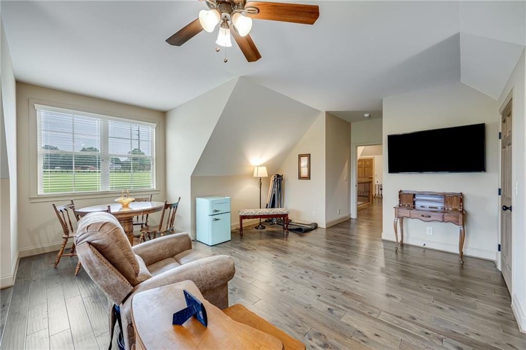 5911 Bent Tree Way Clermont, GA 30527 - Photo 50 of 56 a living room with furniture and a flat screen tv