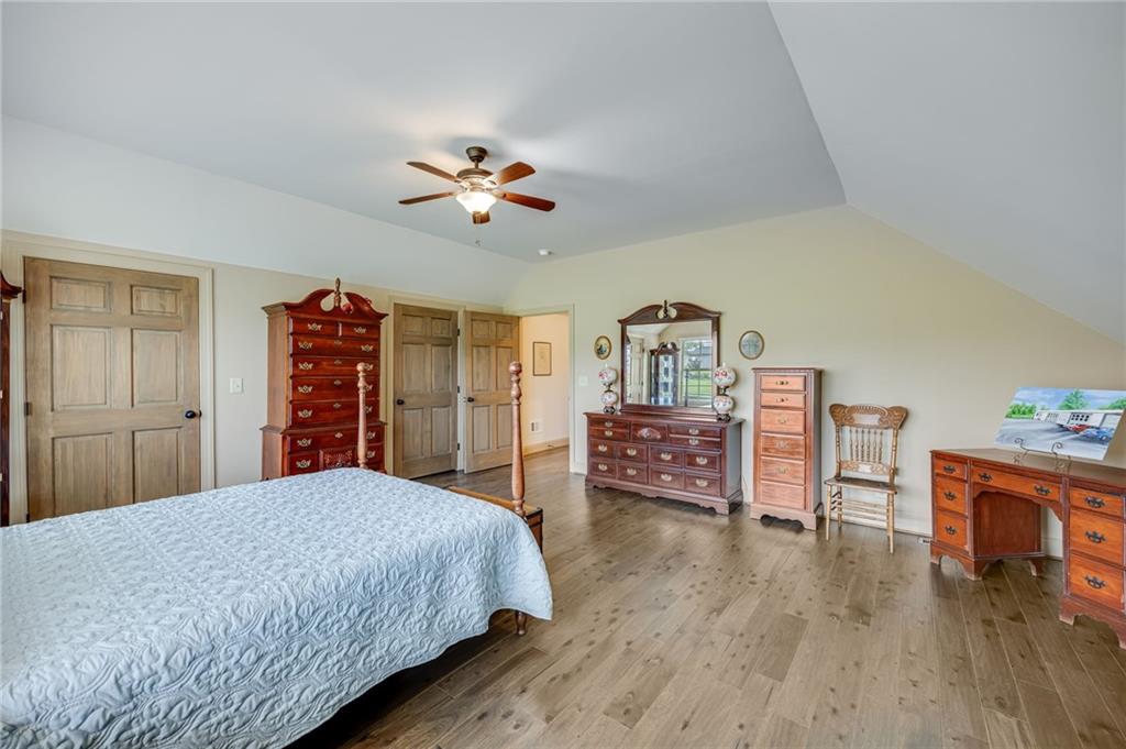 5911 Bent Tree Way Clermont, GA 30527 - Photo 53 of 56 a bedroom with furniture and wooden floor