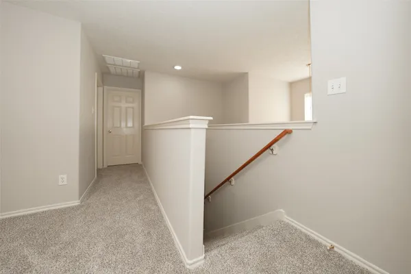 a view of a hallway with entryway