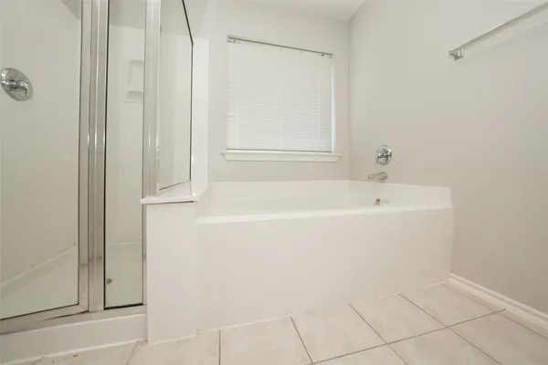 a white bath tub sitting next to a window