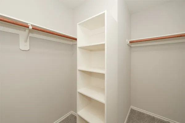 a view of an empty walk in closet