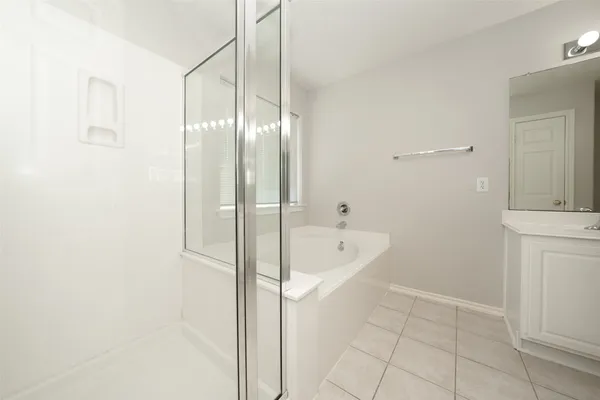 a bathroom with a bathtub and a sink