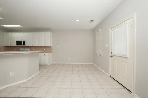 a view of cabinets a sink with wooden floor