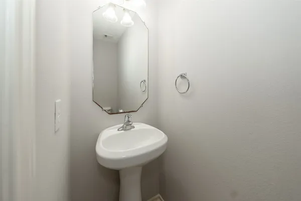 a bathroom with a sink and mirror