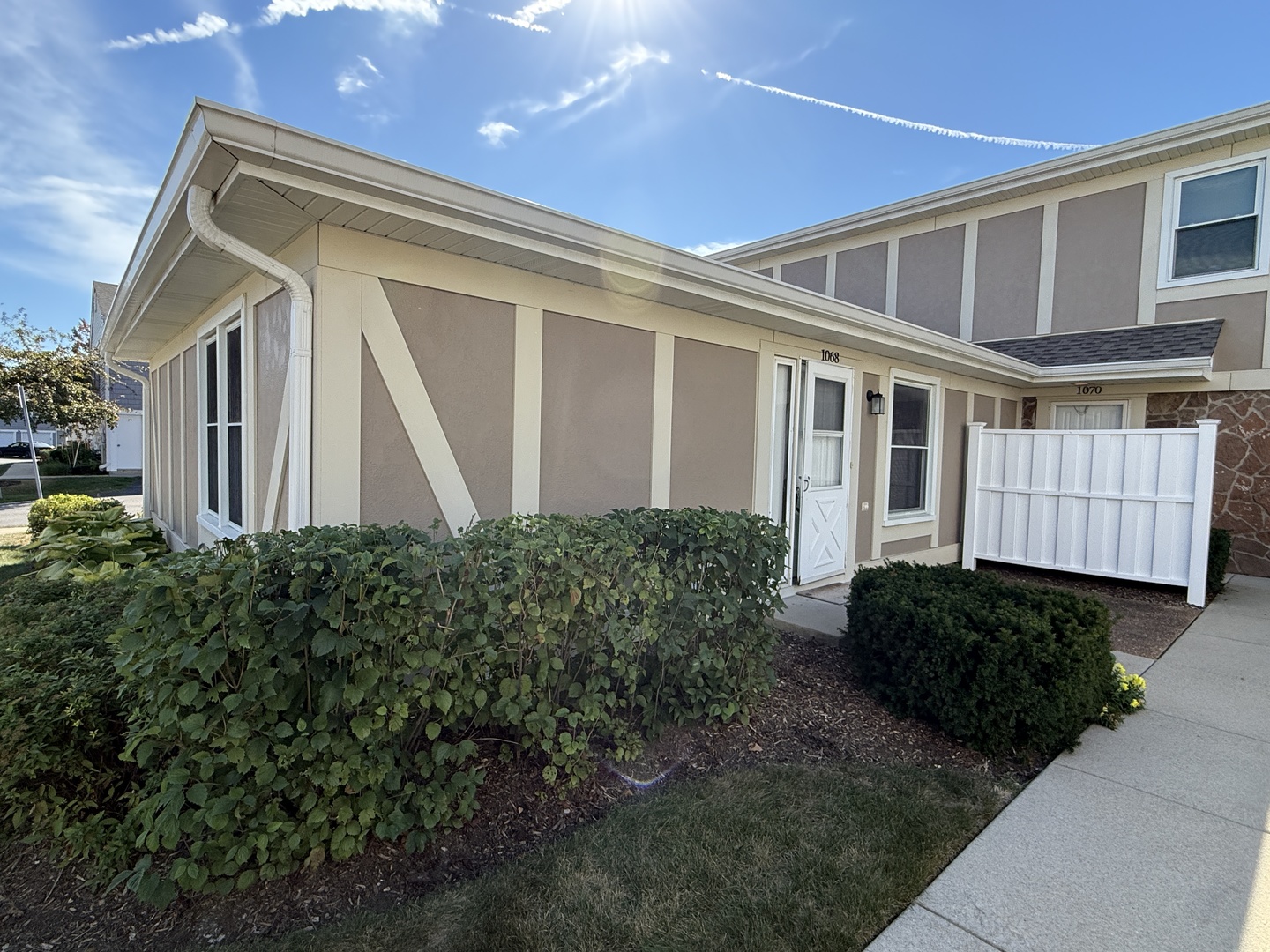 1068 Glouchester Harbor, Unit 1068 Schaumburg, IL 60193 - Photo 1 of 26 a front view of a house with garage
