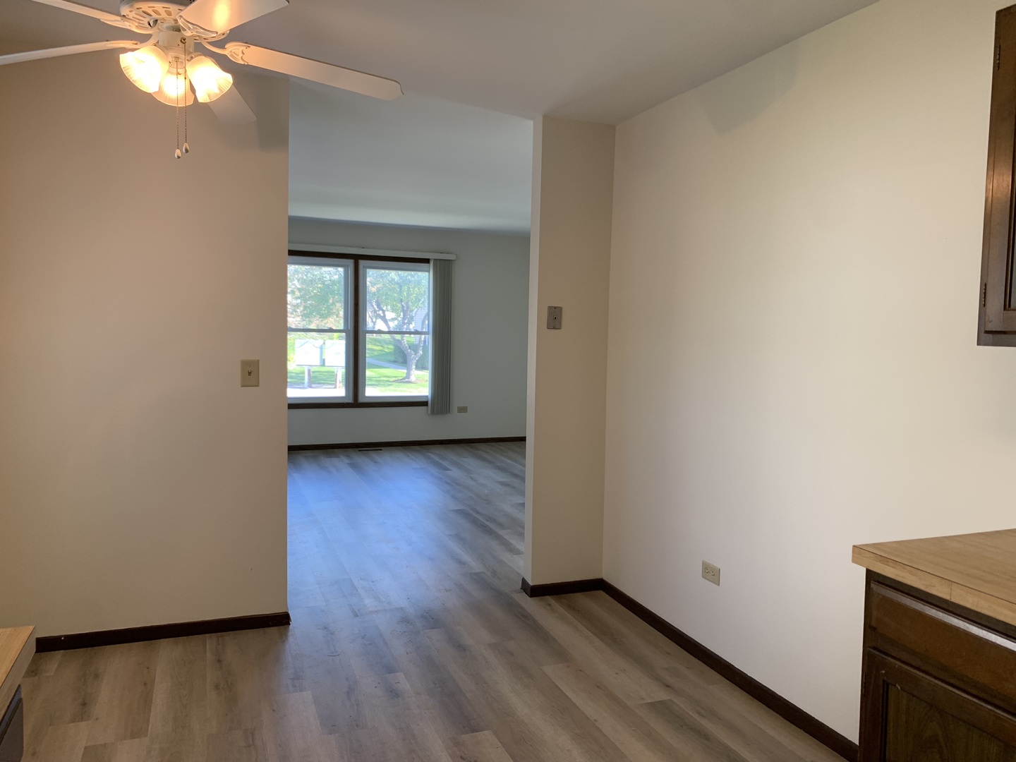 1068 Glouchester Harbor, Unit 1068 Schaumburg, IL 60193 - Photo 12 of 26 an empty room with wooden floor and windows